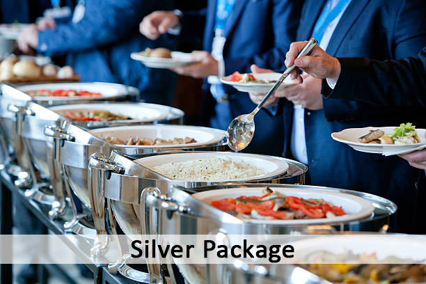 men in blue suits choosing food at a banquet